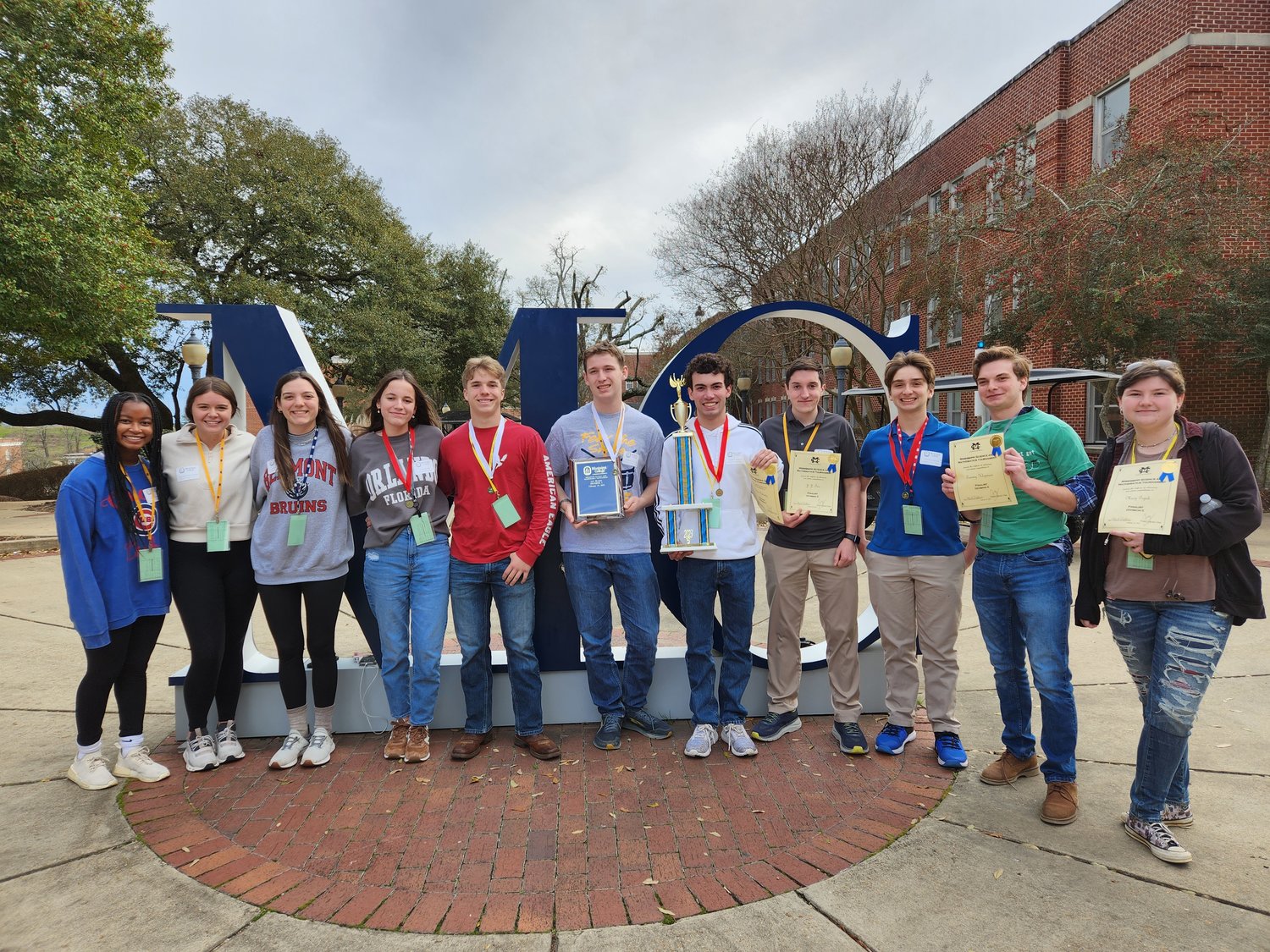 St. Joseph Catholic School took home the overall first-place trophy from this year’s Mississippi Science and Mathematics Tournament. Pictured from left: Alexia Brown; Rachel Donaldson; Lauren Abadie, Leah Munoz, Daniel Dear, Lockard Williams, Andrew Doherty, J.J. Tice, Teddy Klopman, Thomas Klopman, and Mary Topik, who scored in the top 10 percent in chemistry and was on the quiz bowl team.